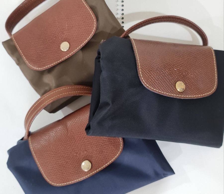 Longchamp Le Pliage Briefcase (Category: Luxury Bags & Wallets) located in Paranaque City. Submitted by dsthings (Listing ID 1249484952, Image 1). Description: Longchamp Le Pliage Briefcase Available colors: Black & Navy - Snap button - Zip closure - Foldable for storage after use - P2,700 (if purchased individually - brand new is $110) - get both for P5,000 Shipping c/o buyer MOP - Gcash / BDO / BPI.