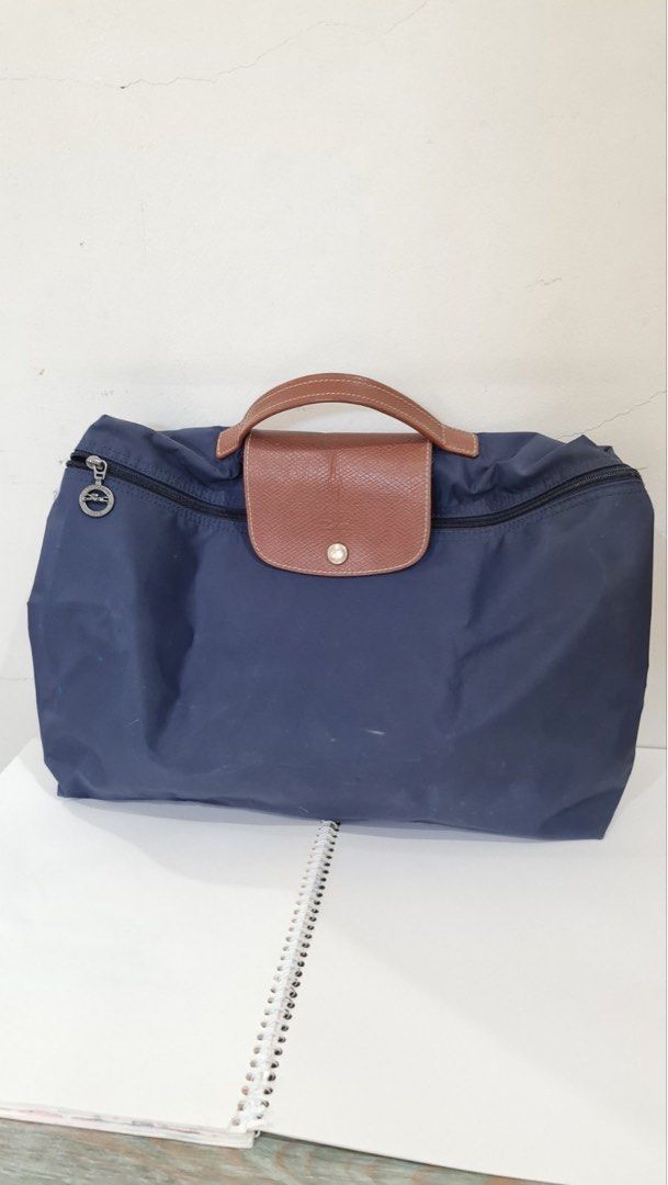 Longchamp Le Pliage Briefcase (Category: Luxury Bags & Wallets) located in Paranaque City. Submitted by dsthings (Listing ID 1249484952, Image 2). Description: Longchamp Le Pliage Briefcase Available colors: Black & Navy - Snap button - Zip closure - Foldable for storage after use - P2,700 (if purchased individually - brand new is $110) - get both for P5,000 Shipping c/o buyer MOP - Gcash / BDO / BPI.