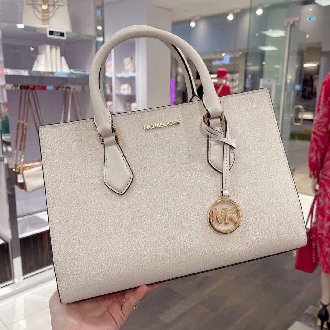 MK Shiel (Category: Luxury Bags & Wallets) located in Pasig City. Submitted by mgmanila (Listing ID 1249605393, Image 3). Description: MK Sheila Satchel Dimensions;9.25”W x 6.25”H x 3.25”D 3,300 ✔️Cash on Pickup (COP) via LBC available ✔️Cash on Delivery (COD) available within Metro Manila only ✔️MOP: Gcash,Maya And Bank transfer ✔️Shipping via Lalamove, Grab and Joyride ✔️Yes to Same day delivery🥰 ✔️Open for Layaway 📩DM us for more info or any