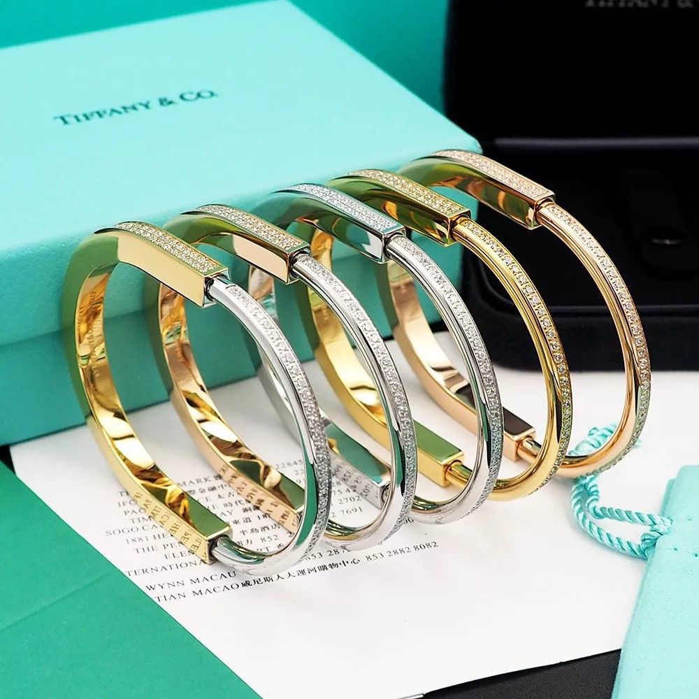 Tiffany & Co Sterling & 18k Gold 25mm Wide Key Lock Bracelet Bangle –  Jewels by Joy