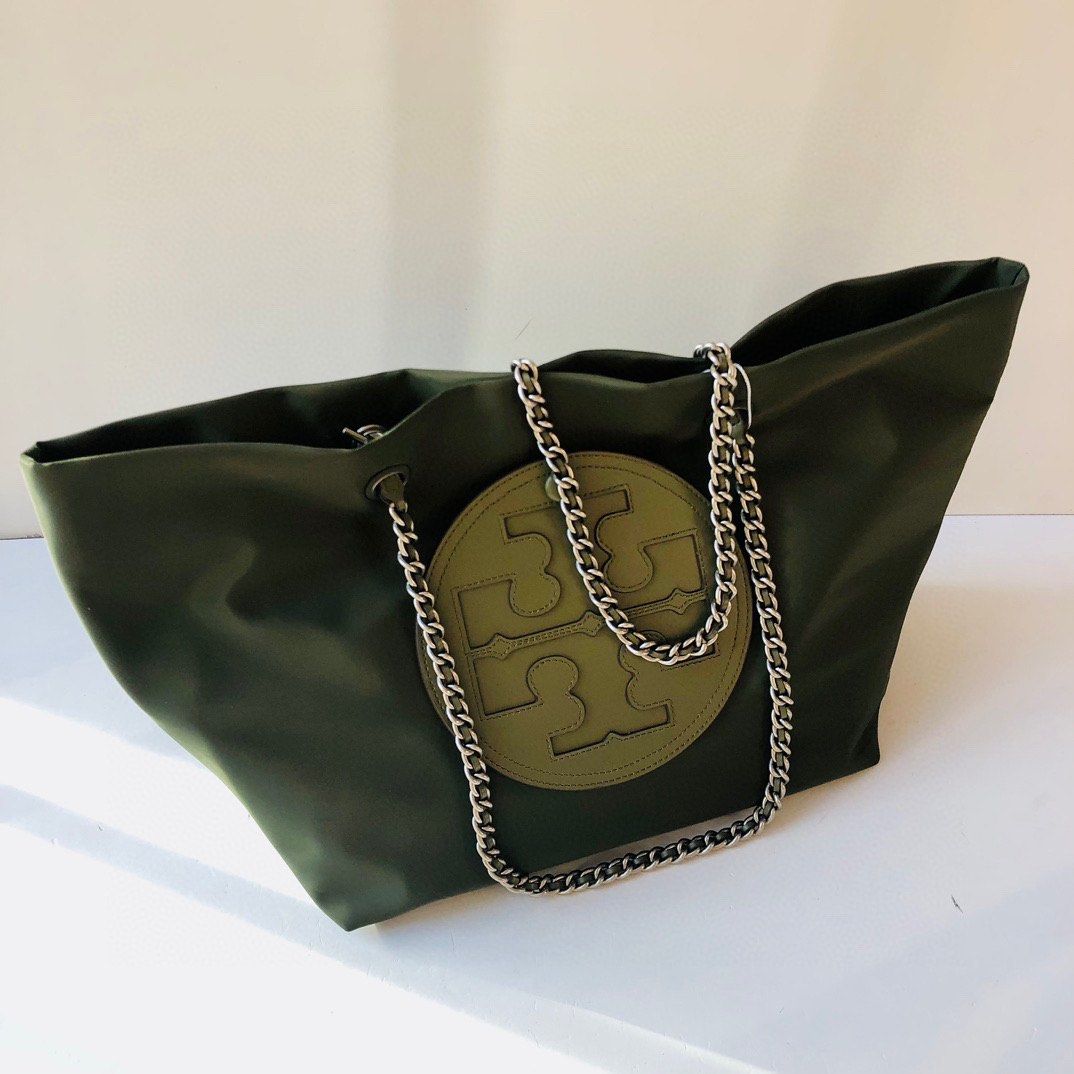 Introducing the Ella Chain Tote. Gold hardware brings sharp