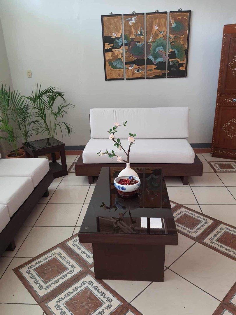 Japandi Sofa made of Solid Mahogany wood (Category: Sofas) located in Paranaque City. Submitted by FLess.ph (Listing ID 1249720075, Image 3). Description: JAPANDI SOFA MADE OF SOLID MAHOGANY WOOD set includes 1 pc 2 seater sofa with 6 inches uratex cushion ( very firm ) Size : 60 inches length 1 pc 4 seater sofa with uratex cushion Size : 83 inches length 1 pc side table ( with free tinted top glass ) 1 center table ( 40 inches length ) with free