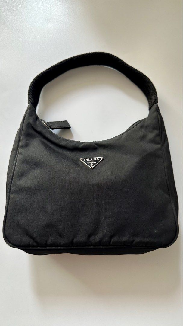 Prada Hobo Bag (Category: Luxury Bags & Wallets) located in Makati City. Submitted by cherrystudios_ (Listing ID 1249672020, Image 1). Description: Bought from Bodega Archive 4 years ago. Guaranteed authentic .