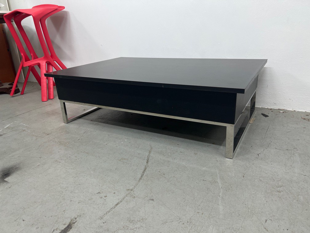 Coffee table outlet that raises up