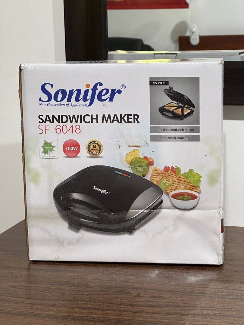 Sonifer Sandwich Maker - Electric Panini Maker (Category: Other Kitchenware & Tableware) located in Marikina City. Submitted by alaya. (Listing ID 1249658286, Image 1). Description: BRAND NEW! ORIGINAL! ✅Grill plate ✅Cool touch housing ✅Power and Ready to cook indicators ✅vertical storage ✅Cord Winder .