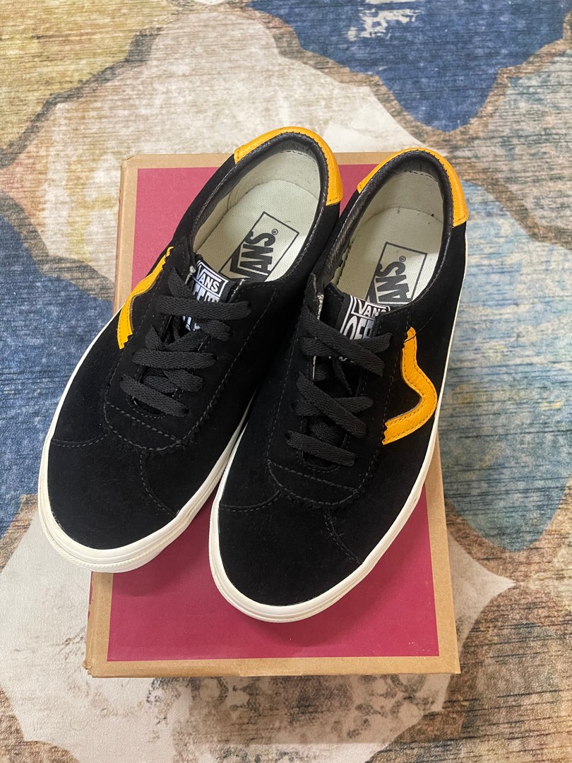 Yellow and black hot sale low top vans