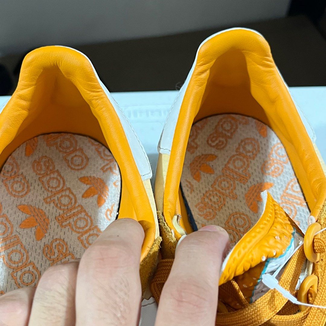 Adidas originals vs fake yellow hot sale