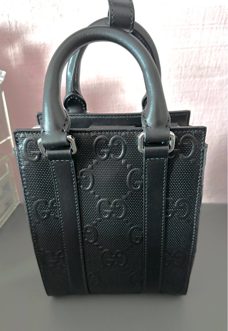 Black embossed on sale gucci bag