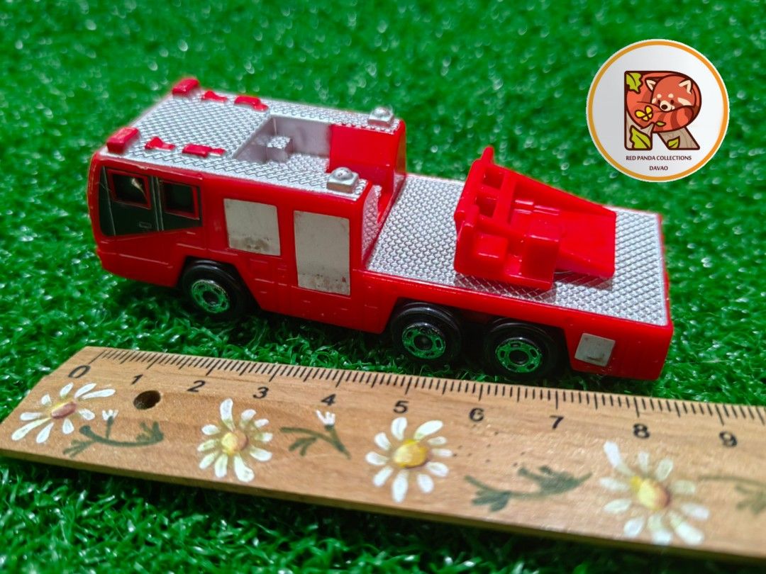 TOMY TOMICA FIRE TRUCK (Category: Vehicle & Diecast Models) located in Davao. Submitted by redpandacollections (Listing ID 1249928602, Image 3). Description: TOMY TOMICA FIRE TRUCK Authentic as is in the picture provided Size 9cm x 3cm x 3cm.