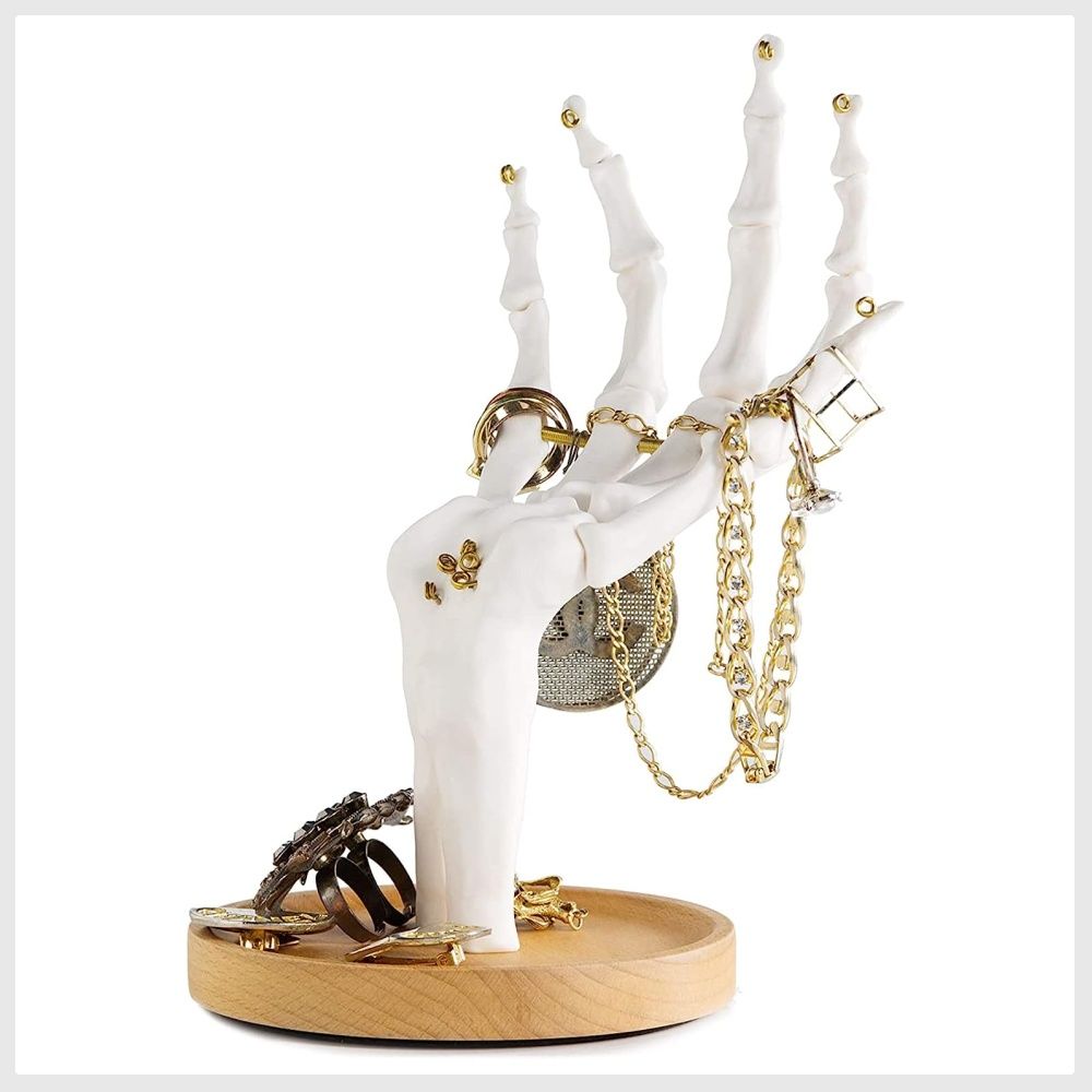 White hand clearance ring holder
