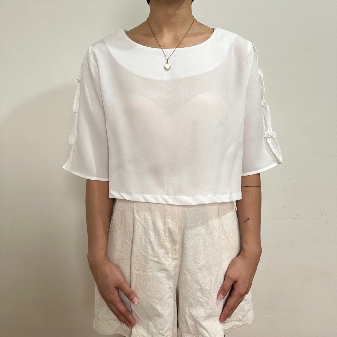 White blouse with pearl detail (Category: Blouses) located in Taytay. Submitted by _prelovedbabies (Listing ID 1249960156, Image 1). Description: White top with pearl detail ✿ size xs-s ✿ a bit see through Model’s measurements: height: 5’3” | bust: 34A | waist: 25” | hips: 36”.