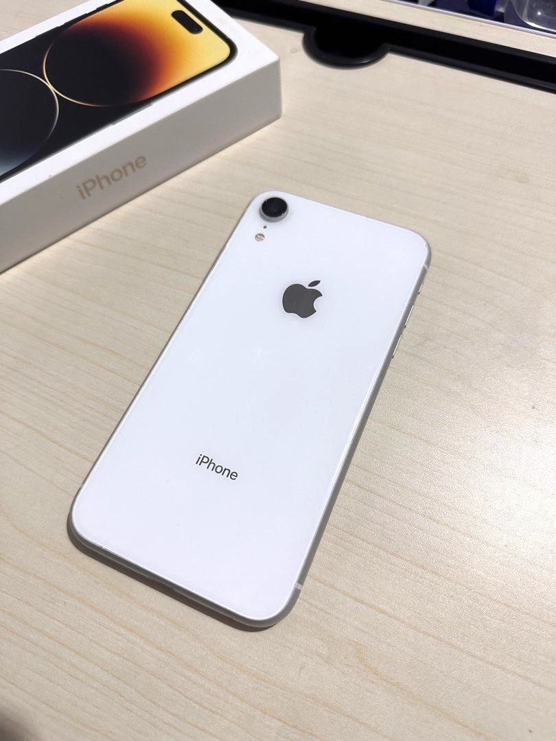 Apple iPhone XR (64 GB) in White (Category: iPhone X Series) located in Quezon City. Submitted by shopfinesse (Listing ID 1246665769, Image 1). Description: iPhone XR 64 GB storage Fully functioning; no operational defects In good condition ⭐️ Minor dents on the edges (see photos for reference) Front screen has a small black dot (see photo for reference) Comes with a charging cable RFS: Bought a new phone.