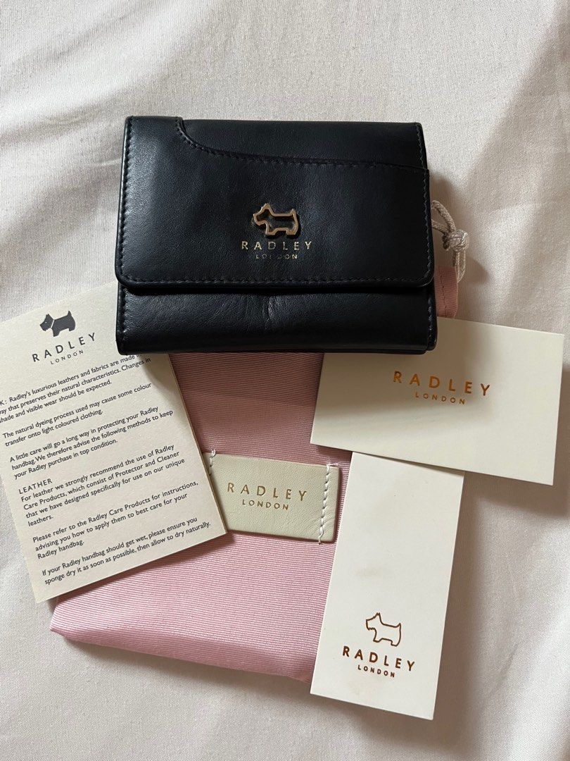Radley wallet (Category: Luxury Bags & Wallets) located in Cavite. Submitted by enjei (Listing ID 1246564128, Image 1). Description: with card slots, coins, and dust bag. No flaws aside from slightly faded radley london logo in front..