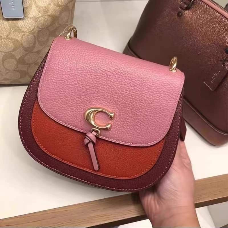 Remi saddle best sale bag coach