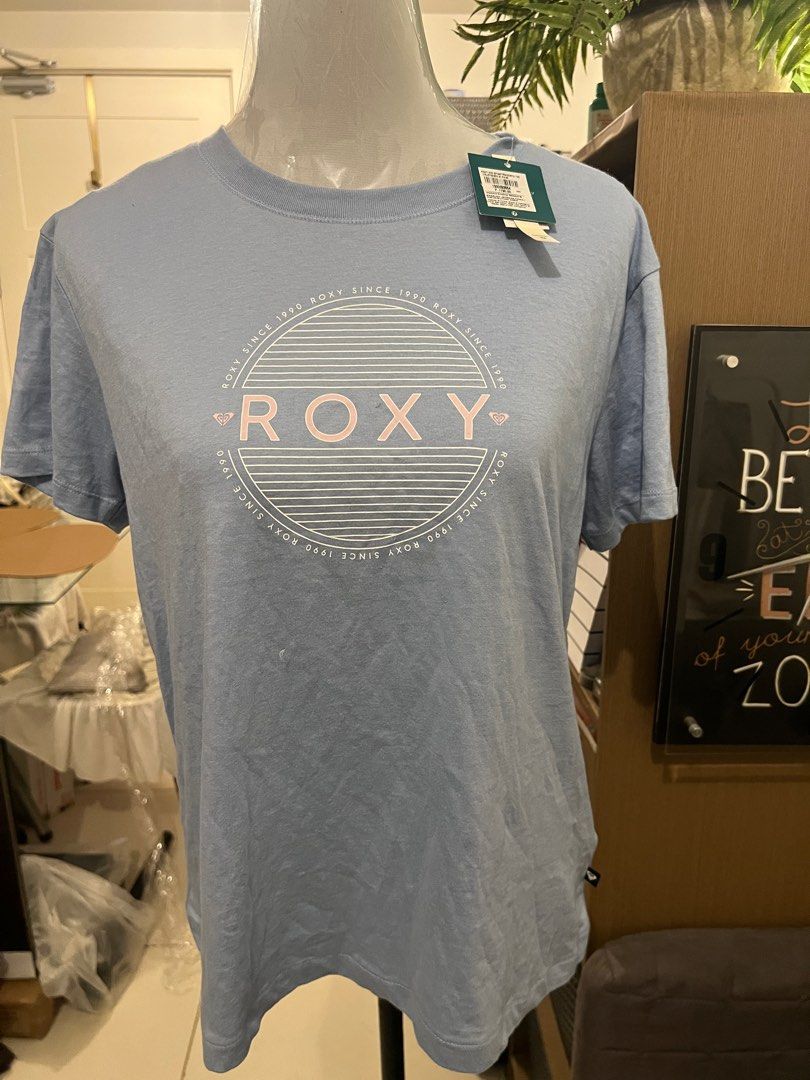 ROXY tshirt (Category: Shirts) located in Quezon City. Submitted by janey_21 (Listing ID 1246648626, Image 1). Description: Still with tag. Pretty light blue color. Authentic. Bought at SM Megamall branch.