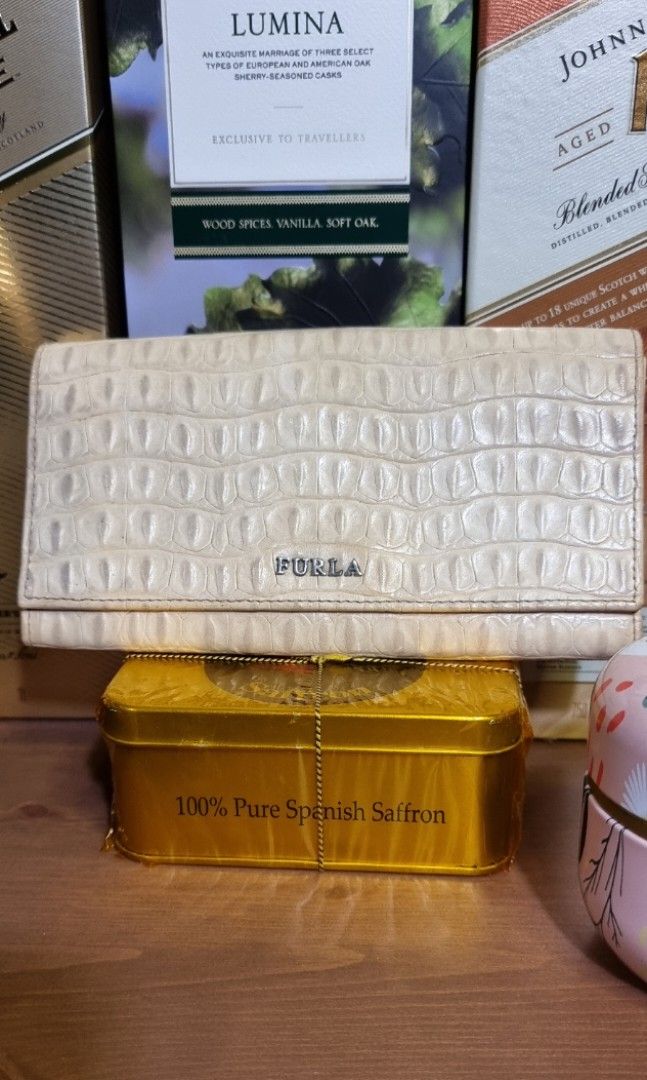 Furla long wallet in crocodile leather (Category: Luxury Bags & Wallets) located in Makati City. Submitted by lilyignacio81 (Listing ID 1250184127, Image 1). Description: personal collection Original Furla long wallet in crocodile leather The Furla Long Wallet in Crocodile Leather – a luxurious and exquisite accessory that combines timeless elegance with the rich texture of crocodile leather. Allow me to guide you through the allure of this excep