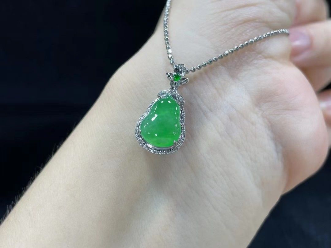 Gold necklace with green pendant sales