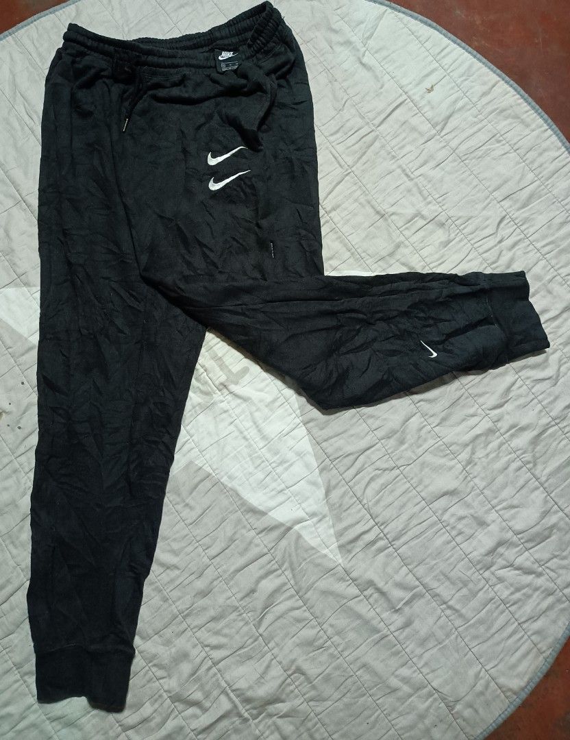 Nike swoosh windbreaker hotsell pants