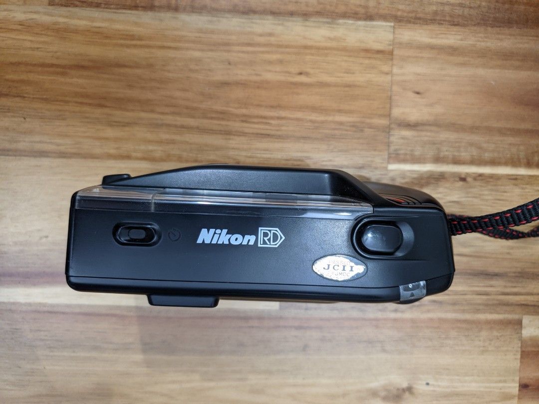 Nikon RD (Category: Cameras) located in Singapore. Submitted by quantom (Listing ID 1250168521, Image 2). Description: Helping my relative clear his old camera gear. Comes as shown in pictures. I've tried slotting in 2 AA batteries - the camera starts making a high pitch whine and seems to take a shot when I depress the shutter button (I don't have any film to test with though). However, I wasn't able to keep the battery bay shut - see last pic..