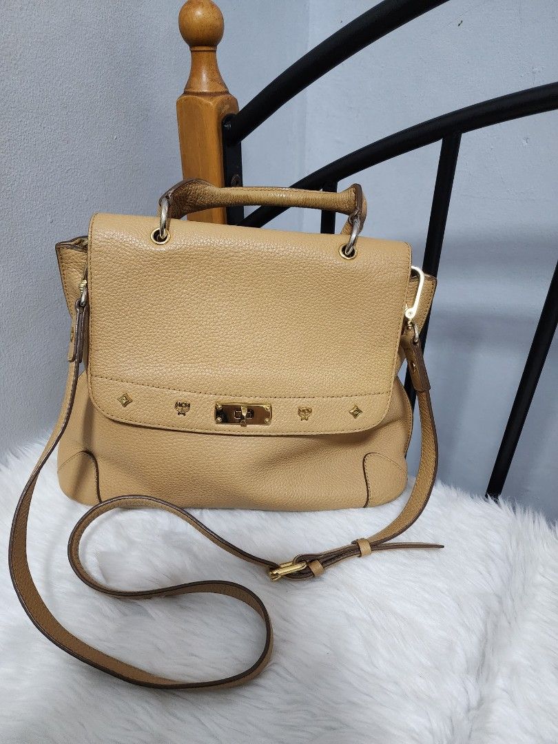 Authentic MCM Two way leather bag (Category: Luxury Bags & Wallets) located in Paranaque City. Submitted by rizasauthenticitems (Listing ID 1250218158, Image 1). Description: Authentic mcm 2 way satchel Excellent condition. Clean in and out with detchable long sling for cross body. With twist lock and mcm logo infront.