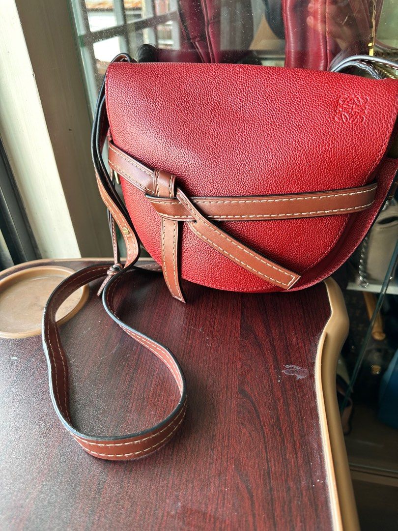 Loewe Gate Small with Entrupy (Category: Luxury Bags & Wallets) located in Quezon City. Submitted by queenieangel (Listing ID 1250196357, Image 1). Description: This small Gate Bag boasts a history that adds to its allure, showcasing its journey alongside its previous owner. With its meticulously designed saddle silhouette and signature knotted front belt, this bag captures the essence of artisanal craftsmanship and modern sophistication. As you 
