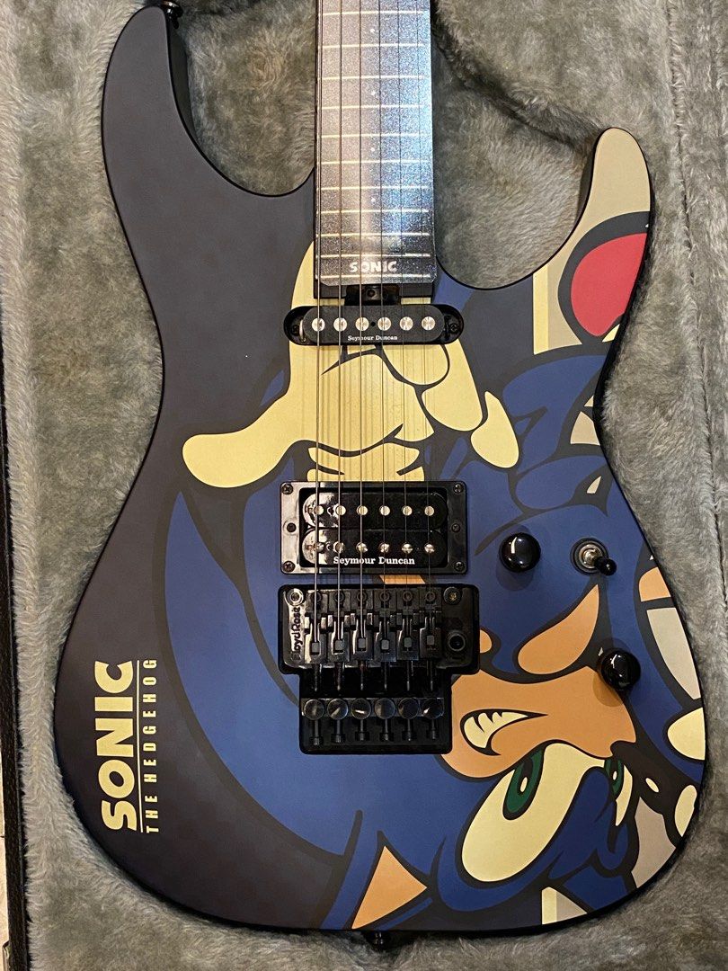 SN - 25th Sonic the hedgehog guitar-II (Category: Musical Instruments) located in Singapore. Submitted by spade51 (Listing ID 1250349187, Image 1). Description: SN-25TH Sonic the hedgehog guitar-II This is the sonic 25th anniversary ESP which was released in limited quantities in 2016. Guitar is in very good condition with minor flaws(some rust on saddle screws of the floyd rose, rusty strings(which can be changed)). Comes with certificate of aut