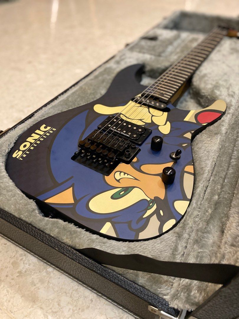 SN - 25th Sonic the hedgehog guitar-II (Category: Musical Instruments) located in Singapore. Submitted by spade51 (Listing ID 1250349187, Image 2). Description: SN-25TH Sonic the hedgehog guitar-II This is the sonic 25th anniversary ESP which was released in limited quantities in 2016. Guitar is in very good condition with minor flaws(some rust on saddle screws of the floyd rose, rusty strings(which can be changed)). Comes with certificate of aut