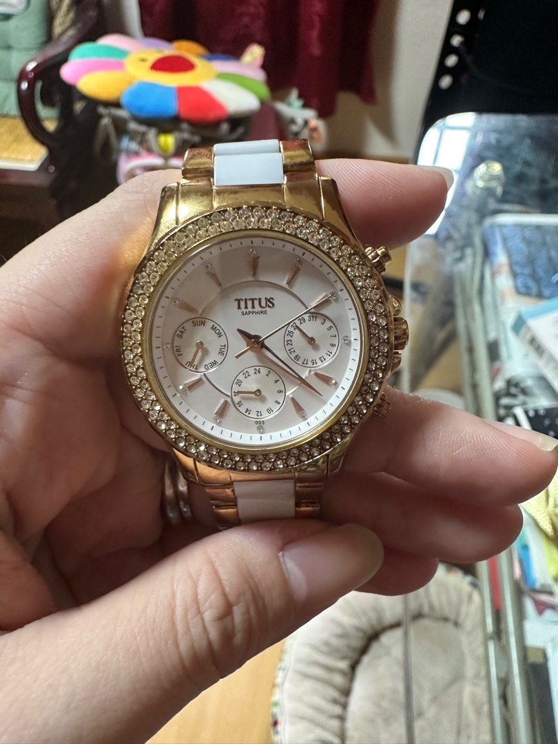 Titus rose gold watch top