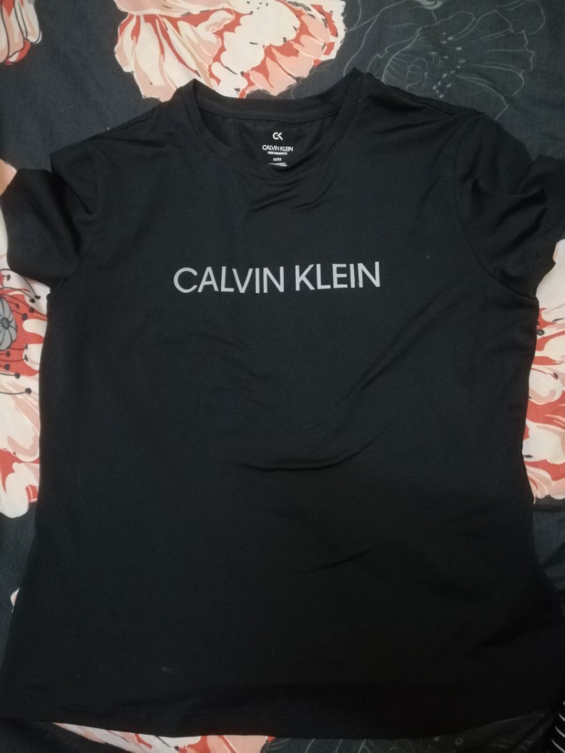 1 set Calvin Klein Performance Tshirt and Leggings, Women's Fashion, Tops,  Shirts on Carousell