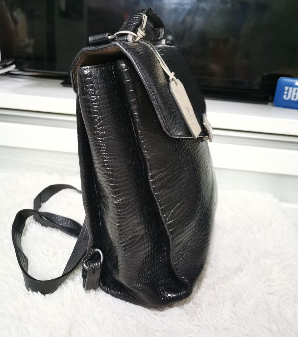 💯BRUNO MAGLI Backpack (Category: Backpacks) located in Cainta. Submitted by phengaying (Listing ID 1250432715, Image 3). Description: Original Bruno Magli Genuine Leather Backpack Medium Size | Re-colored from White to Black | Flaw/s: Small Leather Stain on the back flap closure.