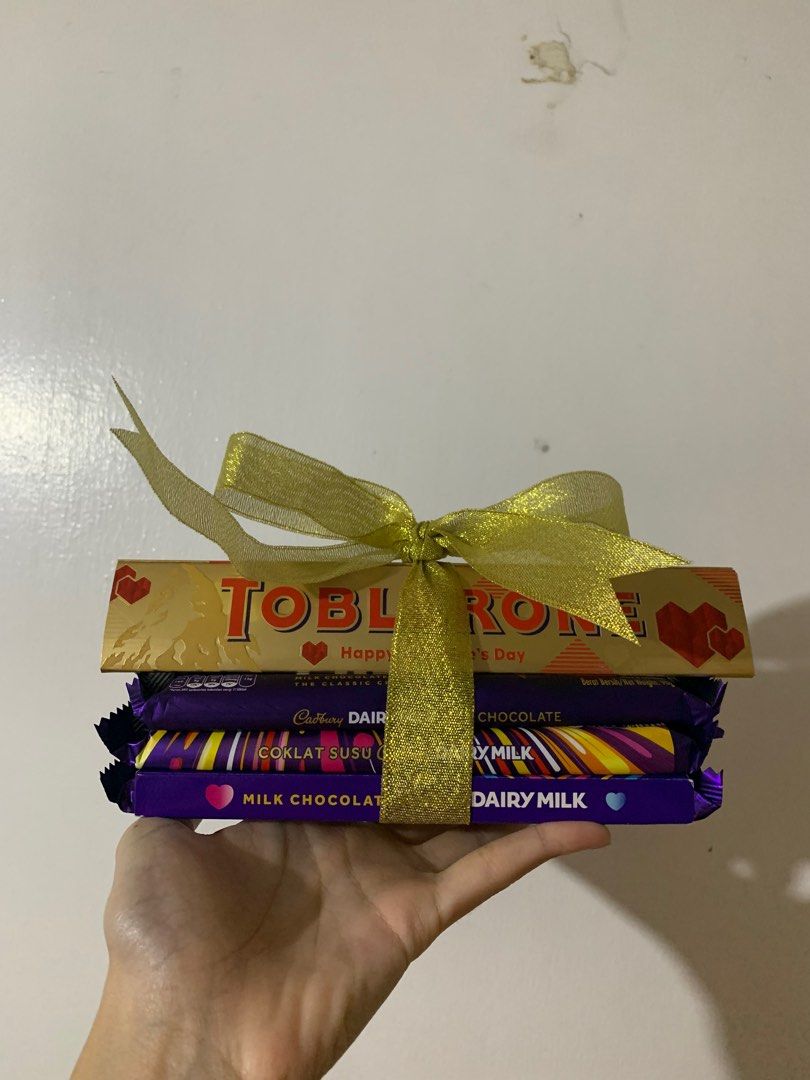 Chocolate Gift Bundle (Cadbury and Toblerone) (Category: Gift Baskets & Hampers) located in Las Pinas. Submitted by samlordgrace (Listing ID 1250519528, Image 1). Description: Chocolate bundle for birthday, anniversary, and other occasions Note: Customizable depending on availability .