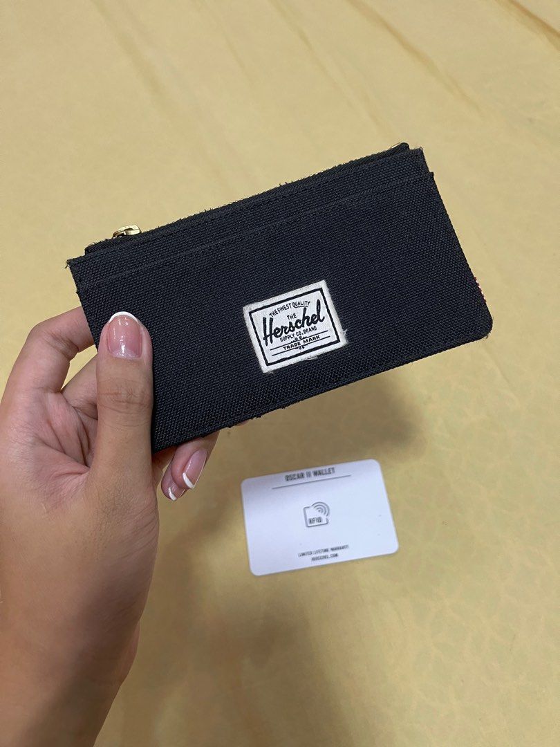 Herschel Oscar Card Holder Wallet (Category: Wallets & Card holders) located in Taytay. Submitted by nadsandthings (Listing ID 1250431172, Image 1). Description: Herschel Oscar Li RFID Wallet (Black) Super great condition! Bought in UPTC Herschel RFS: Have too much wallets na.