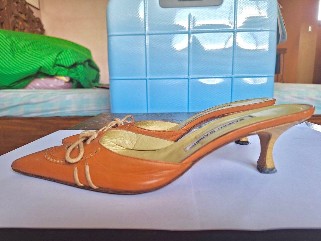 Manolo Blahnik Orange Kitten Heel Mules (Category: Heels) located in Quezon City. Submitted by belblossom (Listing ID 1250425351, Image 2). Description: Step into retro chic with these exquisite Manolo Blahnik vintage orange kitten heel mules! 🧡✨ Elevate your style with a touch of timeless elegance and a pop of color. Available now for those who appreciate classic fashion with a twist. Size: 38 1/2. Slide into sophistication! Status: no heel dra