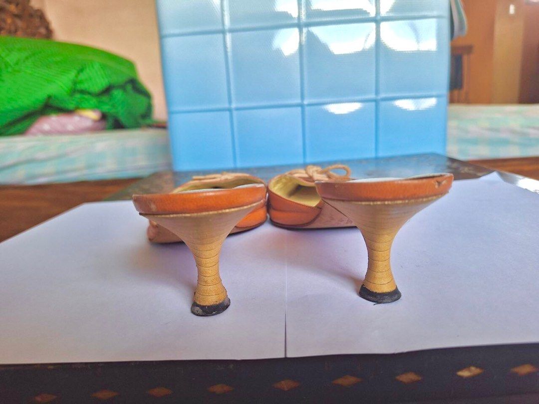 Manolo Blahnik Orange Kitten Heel Mules (Category: Heels) located in Quezon City. Submitted by belblossom (Listing ID 1250425351, Image 3). Description: Step into retro chic with these exquisite Manolo Blahnik vintage orange kitten heel mules! 🧡✨ Elevate your style with a touch of timeless elegance and a pop of color. Available now for those who appreciate classic fashion with a twist. Size: 38 1/2. Slide into sophistication! Status: no heel dra