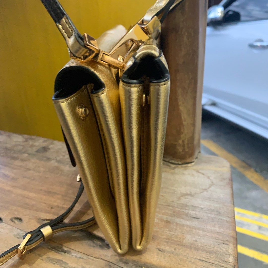 Coccinelle Leather Gold Metallic Sling (Category: Luxury Bags & Wallets) located in Davao. Submitted by bagooohdavao (Listing ID 1250582344, Image 3). Description: Coccinelle | Excellent Condition| 📌P 1800.