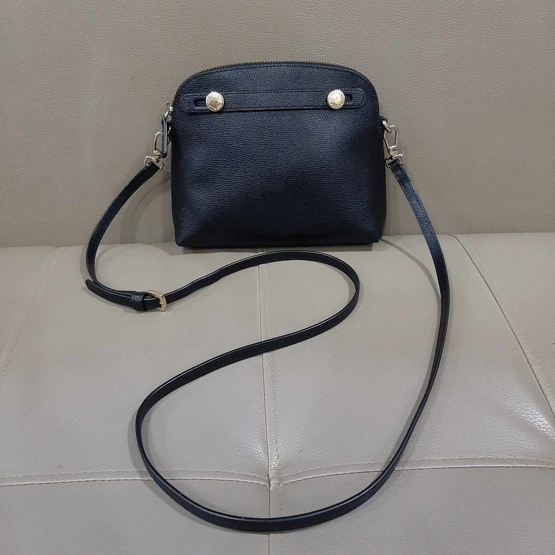 Furla Mini Alma Type Sling Bag (Category: Luxury Bags & Wallets) located in Taguig. Submitted by esa.agustin (Listing ID 1250700651, Image 1). Description: Original Furla mini black leather sling bag. With dust bag..