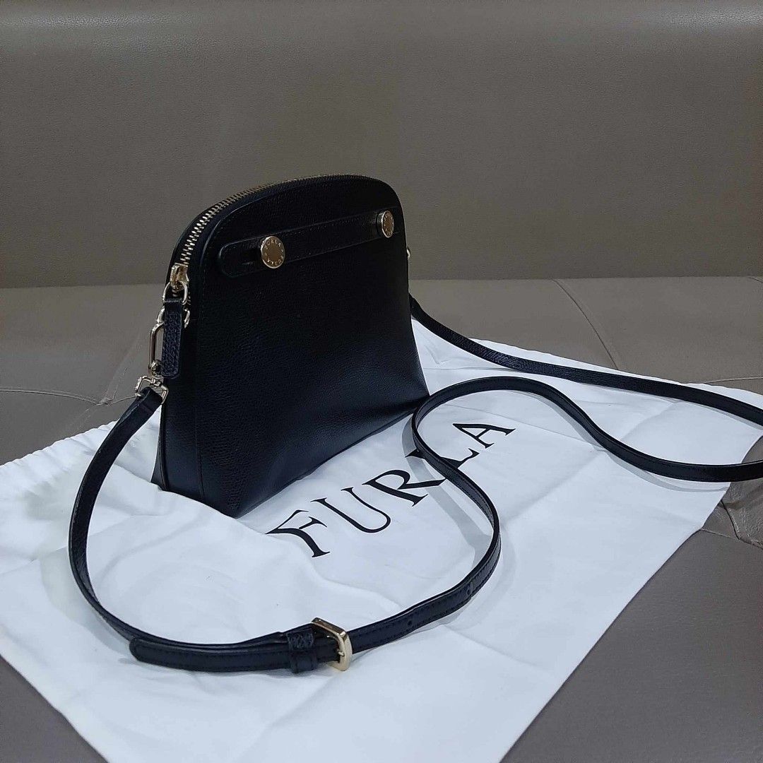 Furla Mini Alma Type Sling Bag (Category: Luxury Bags & Wallets) located in Taguig. Submitted by esa.agustin (Listing ID 1250700651, Image 2). Description: Original Furla mini black leather sling bag. With dust bag..