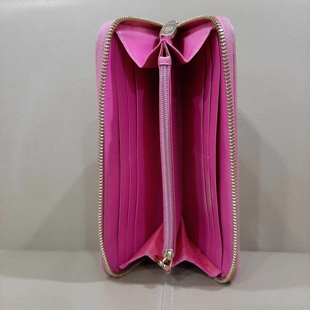 MCM Pink Long Zipper Wallet (Category: Luxury Bags & Wallets) located in Taguig. Submitted by esa.agustin (Listing ID 1250707762, Image 3). Description: Original MCM pink pvc leather long zipper wallet. Made in Korea.