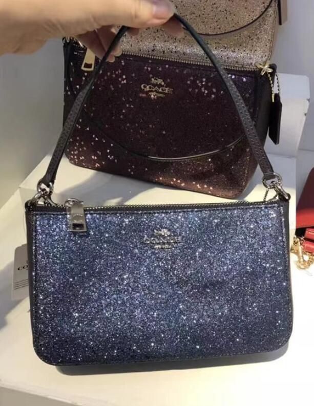 Coach top handle pouch with star glitter new arrivals