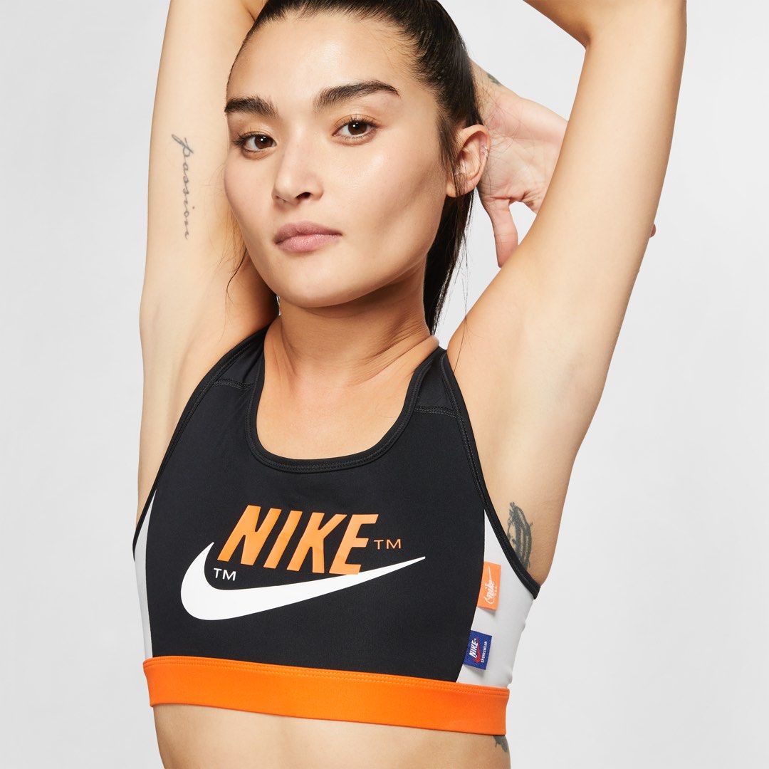Nike Women's sports bra polyester/spandex blend medium pad icon clash bra  black/orange, Women's Fashion, Activewear on Carousell