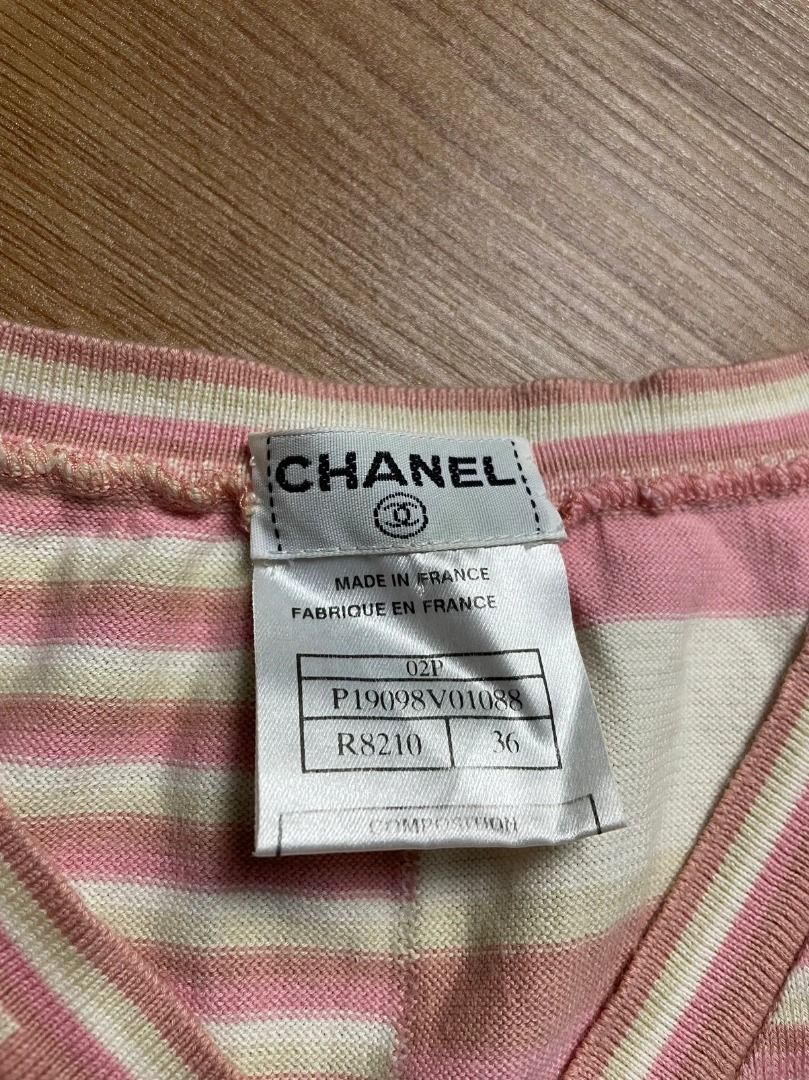 Chanel Y2K Striped knitted top Authentic (Category: Sleeveless) located in Alaminos. Submitted by benta_stashed (Listing ID 1250815116, Image 3). Description: Chanel 2002 knitted tanktop Crafted with a horizontal stripe pattern, this V-neck knitted top from Chanel is the perfect addition to your Y2K drip Condition: used but no issues considering it’s from 2002 Size: 36 on tag fits S-M Dimensions: 14” chest x 19.5” length P19098V01088.
