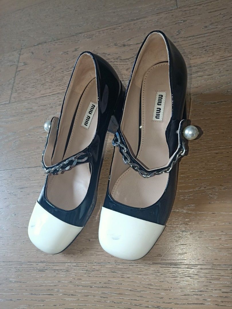 MIU MIU Patent Leather Heels (Category: Heels) located in Candon. Submitted by authenticprelovetolove (Listing ID 1250817949, Image 2). Description: Miu Miu Mary Jane Pumps stain in front both shoe.