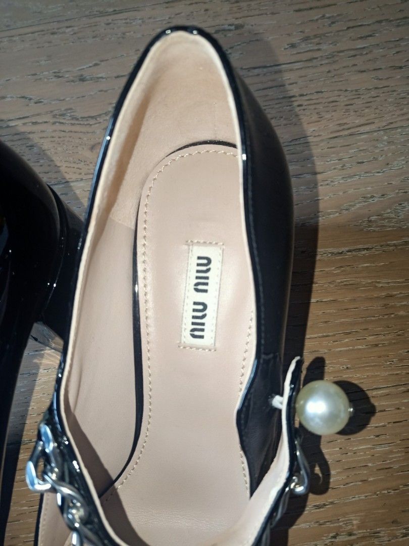 MIU MIU Patent Leather Heels (Category: Heels) located in Candon. Submitted by authenticprelovetolove (Listing ID 1250817949, Image 3). Description: Miu Miu Mary Jane Pumps stain in front both shoe.