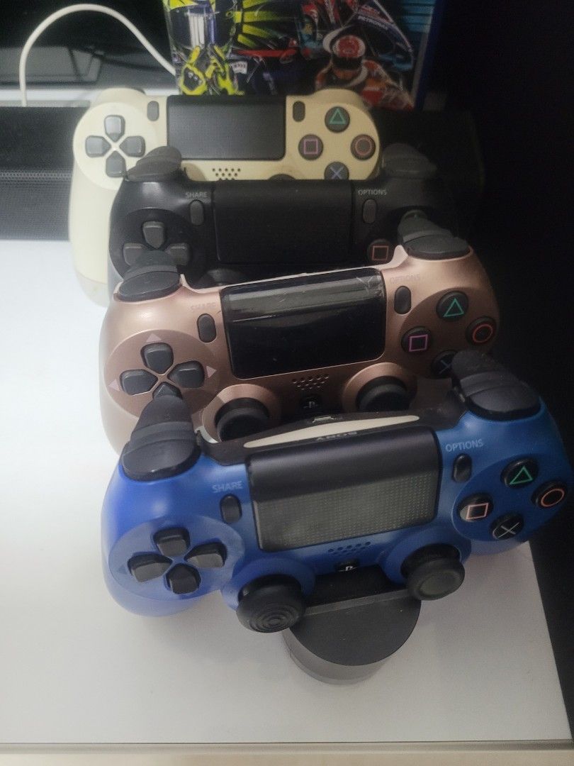 PS4 with 4x controls, charging station and games, Video Gaming, Video Game  Consoles, PlayStation on Carousell