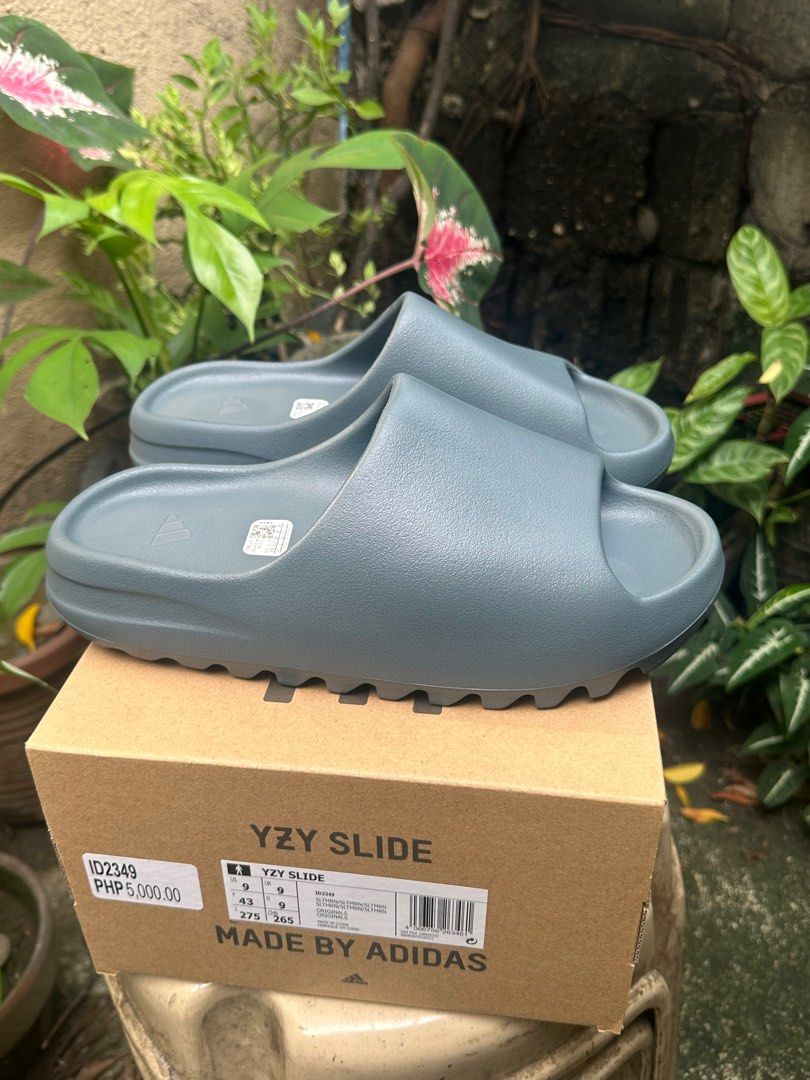 Yeezy Slides Slate Marine (Category: Slippers & Slides) located in Makati City. Submitted by evrlg (Listing ID 1250822144, Image 1). Description: FOR SALE/TRADE Yeezy Slides Slate Marine Size 9UK (3 pairs available) Brand new; Local release Php 6,000 (less 500 if you follow me on ig @peter.kicks1210) Makati/BGC.