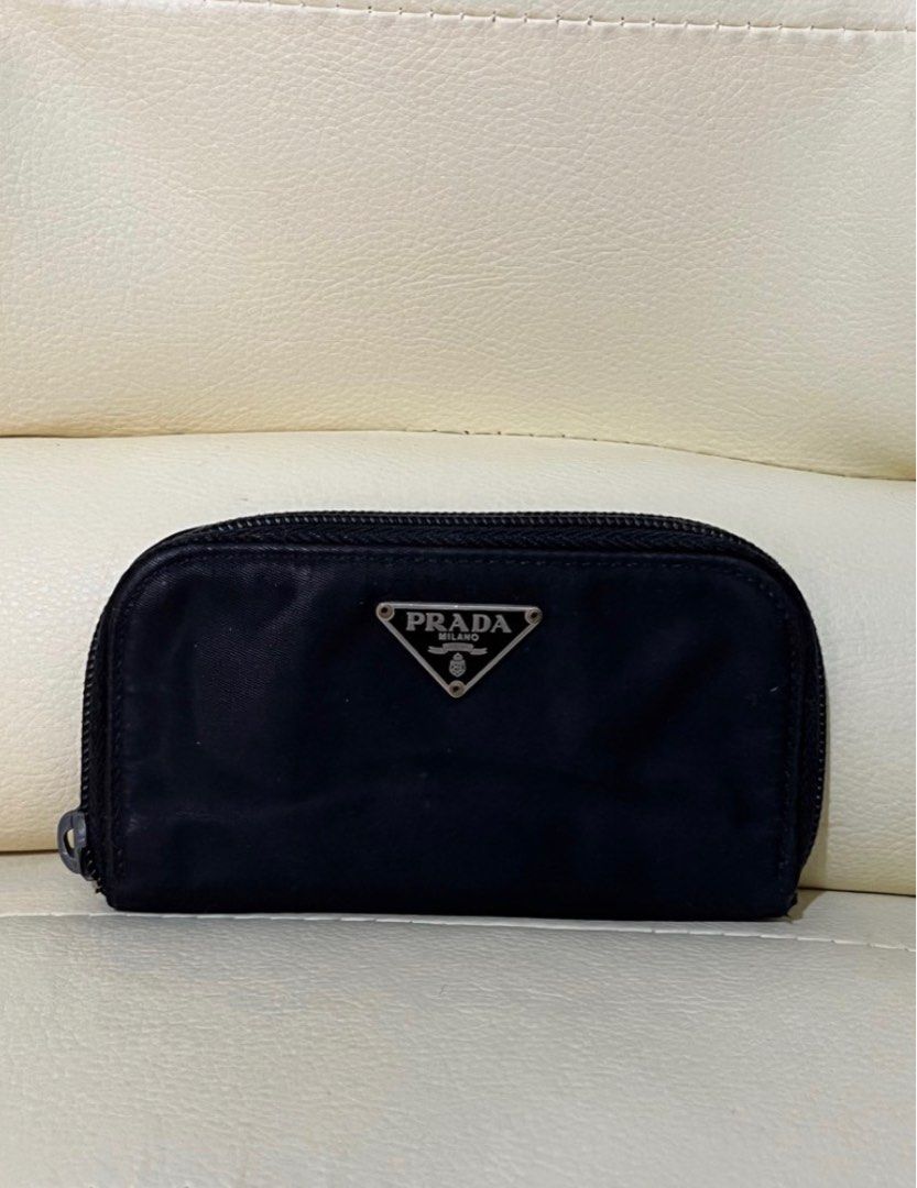 100% Authentic Prada Nylon Key Holder (Category: Luxury Bags & Wallets) located in Antipolo. Submitted by kiksy.closet (Listing ID 1251066287, Image 1). Description: Authentic Prada Nylon Key Holder - Guaranteed authentic! Money back guaranteed. Pls see details of the key holder. I bought this in Japan in 2019, and used it as a cardholder and a key holder. - Condition: 8/10. It has a few foldings on the nylon material; there is one missing key ho