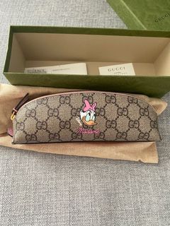 Disney x Gucci Daisy Duck pencil case in beige and ebony GG Supreme