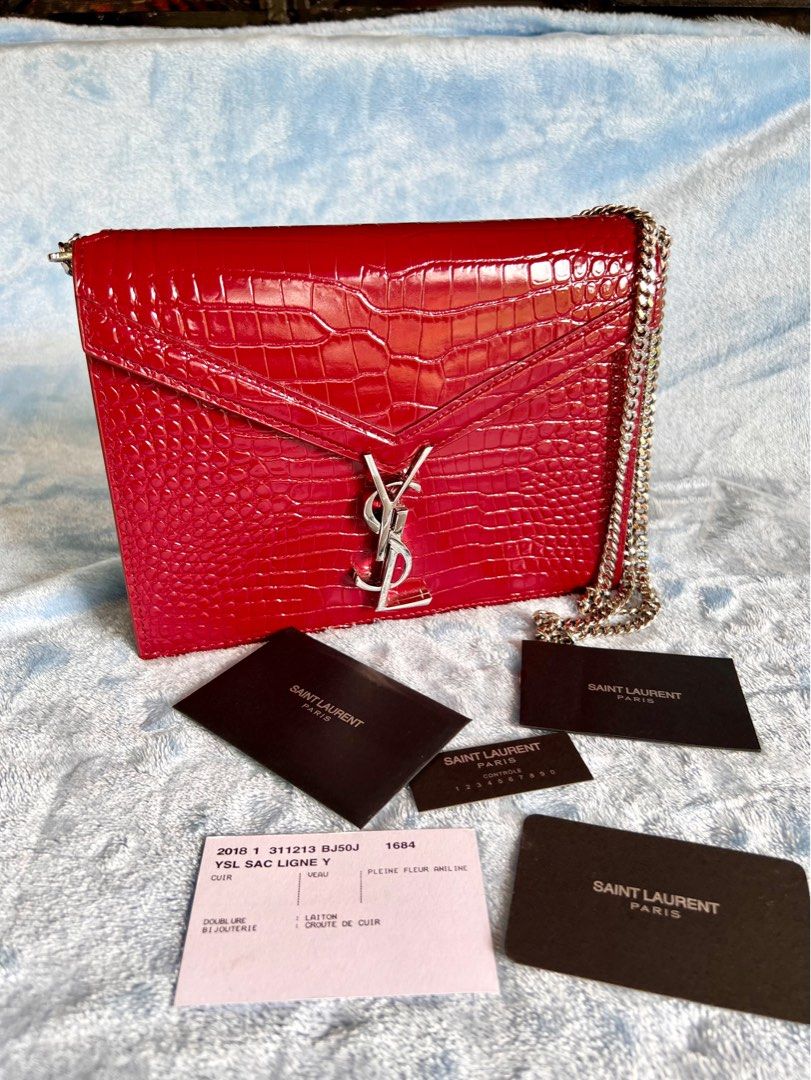 YSL Cassandra Croc-embossed Bag (Category: Luxury Bags & Wallets) located in Rosario. Submitted by yazah.shop (Listing ID 1185479305, Image 1). Description: Condition: 8.5/10 Two-way bay, can be worn as a shoulder or a crossbody/sling bag No dust bag but will give another brand’s dust bag Metal hardwares are still shiny Comes with care cards and authenticity card.