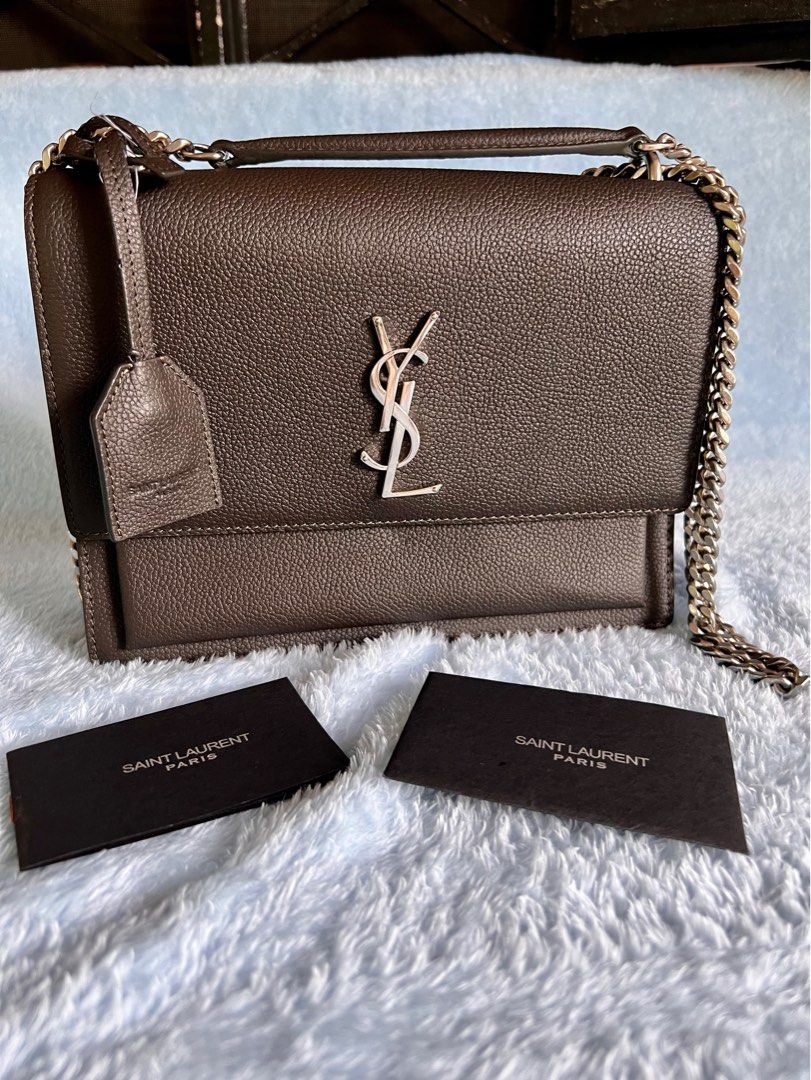 YSL Sunset Small Two-way Bag (Category: Luxury Bags & Wallets) located in Rosario. Submitted by yazah.shop (Listing ID 1224413041, Image 1). Description: Condition: 9/10, minimal signs of usage Comes with dust bag and care card Japan source Metal hardwares are still shiny and no visible scratches, clean inside and out Can be worn as a shoulder, crossbody/sling bag Authentic grained leather, suede inside, with searchable code Shipping thru LBC, ne