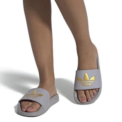 Gold adidas slides womens store